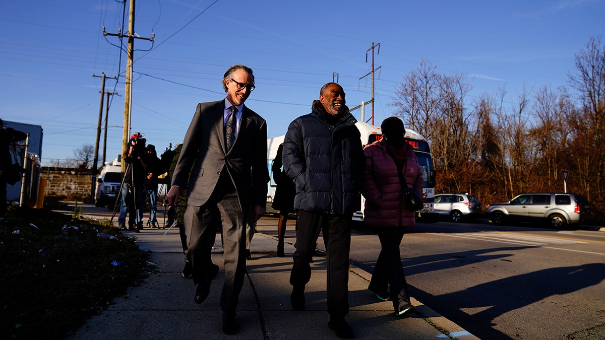 Willie Stokes, center, and lawyer Michael Diamondstein walk in Chester, Pennsylvania, on Tuesday, Jan. 4, 2022, after Stokes' 1984 murder conviction was overturned because of perjured witness testimony.