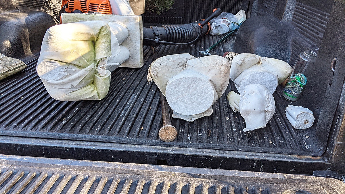 Destroyed statues being taken down.