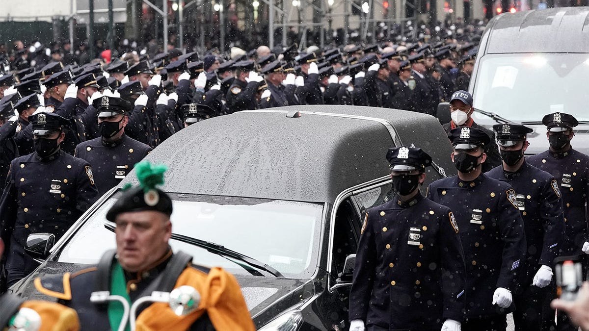 A hearse carries the casket during funeral service for New York City Police Department (NYPD) officer Jason Rivera, who was killed in the line of duty while responding to a domestic violence call, at St. Patrick's Cathedral in the Manhattan borough of New York City, U.S., January 28, 2022. 