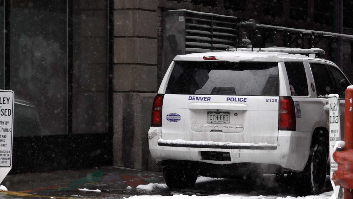 Denver Police car sits in an alley near 16 St Mall