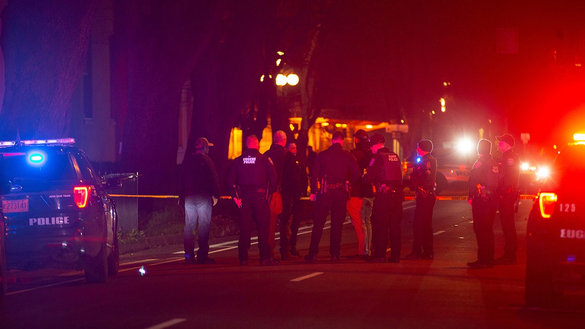 Eugene Police stand in the middle of Lincoln Street after a shooting outside the WOW Hall in Eugene Friday night.Eug 011422 Shooting 03