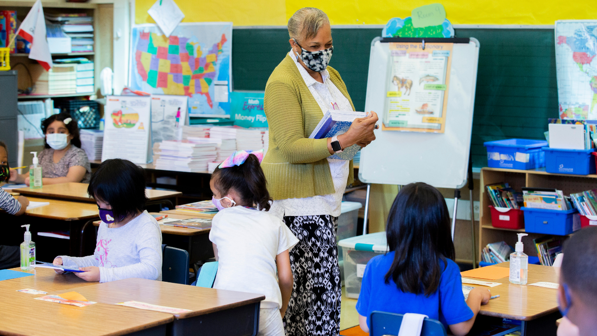 OAKLAND, CA - AUGUST 11: Joy Harrison instructs her second graders ahead of California Gov. Gavin Newsom visiting the classroom at Carl B. Munck Elementary School, Wednesday, Aug. 11, 2021, in Oakland, Calif. The governor announced that California will require its 320,000 teachers and school employees to be vaccinated against the novel coronavirus or submit to weekly COVID-19 testing. (Santiago Mejia/San Francisco Chronicle via Getty Images)