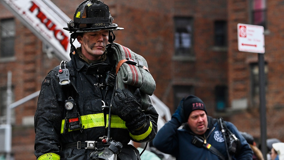 Emergency personnel respond to a high rise fire at 333 East 181 Street, Sunday, Jan. 9, 2022, in the Bronx borough of New York.