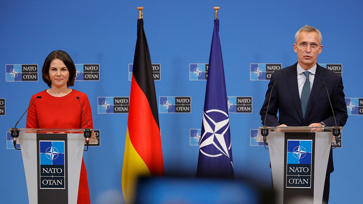 German Foreign Minister Annalena Baerbock and NATO Secretary General Jens Stoltenberg speak during a press conference in Brussels, Belgium, Thursday, Dec. 9, 2021.