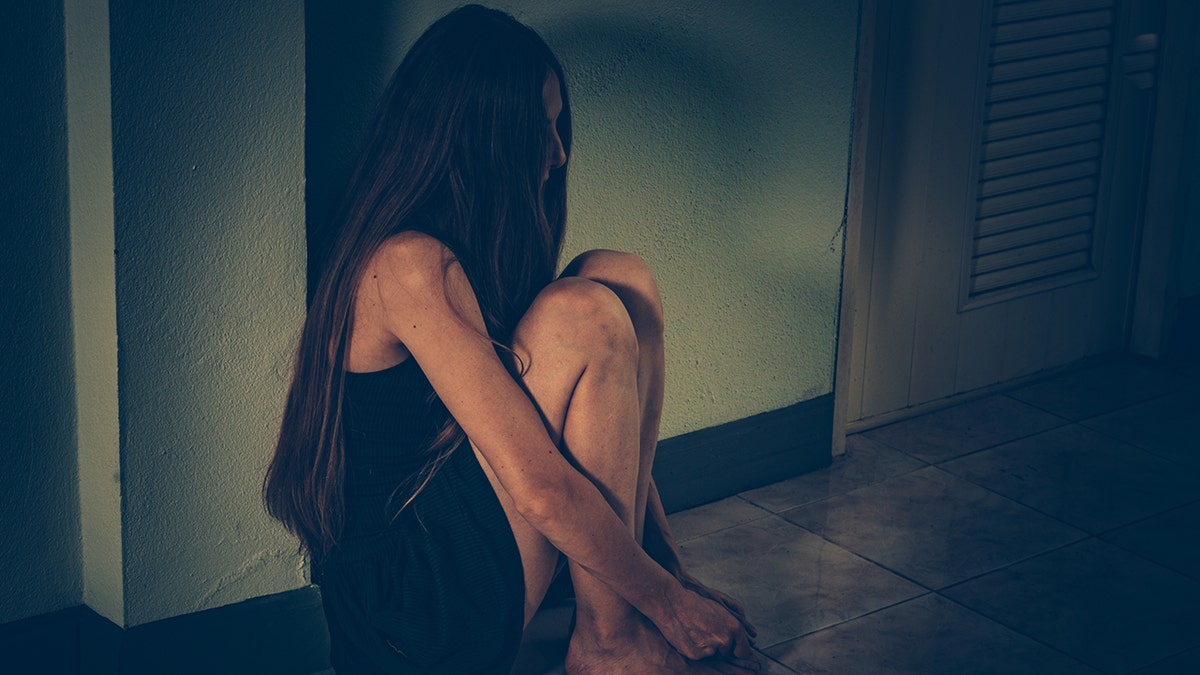 Girl sitting on the floor