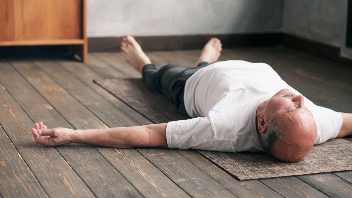 Man lying on carpet