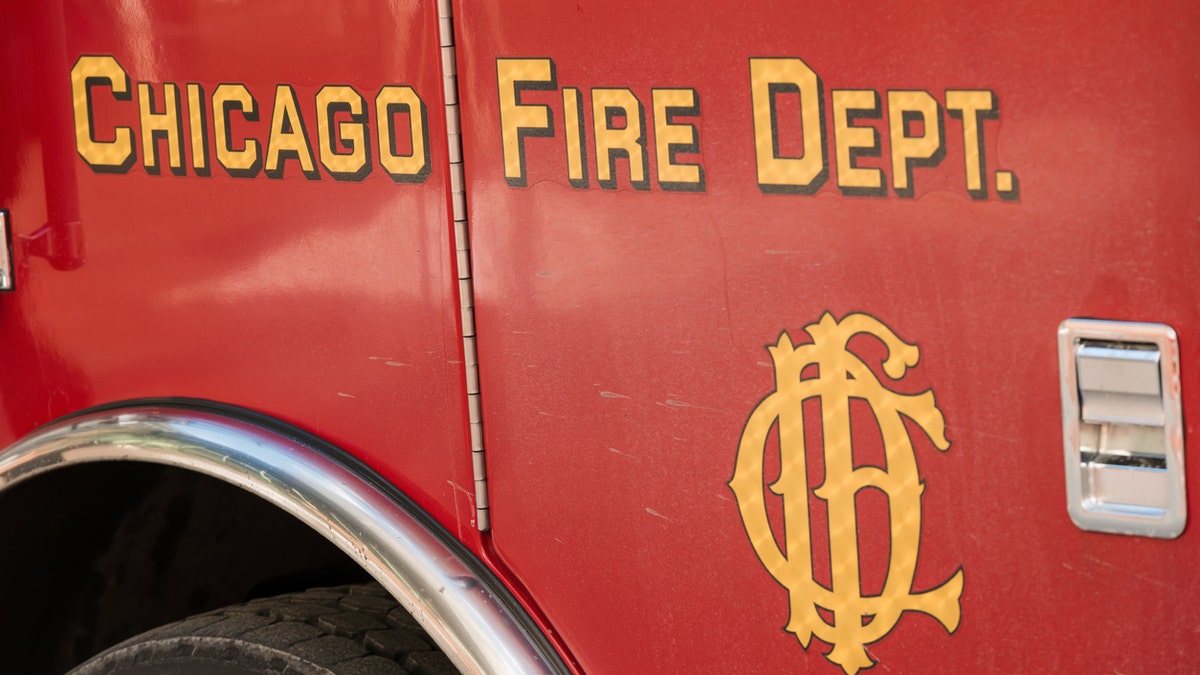 Seattle - The door of a fire truck sitting in front of the Sears Tower on West Jackson street responding to a call late in the day.