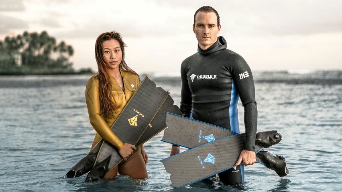 Free diver Yanna Xian (left) and photographer Mitch Brown (right) have swum with whales before in their home city of Honolulu.
