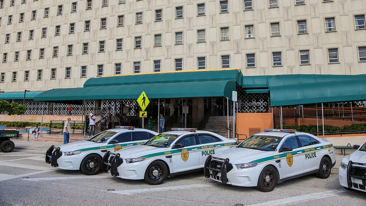 Police cars are seen outside the Miami-Dade County courthouse in Miami, Florida on November 8, 2019. Recently, a Miami-Dade police veteran shot a teen in the neck after a car chase.
