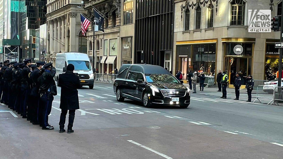 Hundreds of police officers waited outside the Midtown church and held a moment of silence as Rivera's casket was carried inside.
