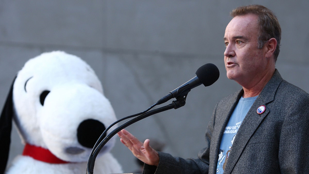 Voice actor Peter Robbins (R) and Snoopy attend the DVD release for Warner Home Video's "You're Not Elected, Charlie Brown" held at the Hollywood & Highland courtyard on October 7, 2008 in Hollywood.