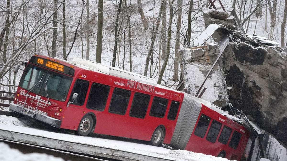 Rescuers rappelled nearly 150 feet to help stranded bus passengers.