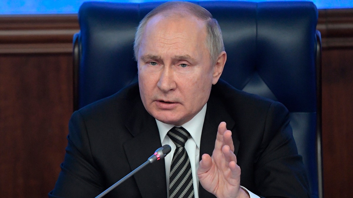 Russian President Vladimir Putin gestures while speaking at an extended meeting of the Russian Defense Ministry Board at the National Defense Control Center in Moscow, Russia, Dec. 21, 2021. (Sergey Guneyev, Sputnik, Kremlin Pool Photo via AP, File)