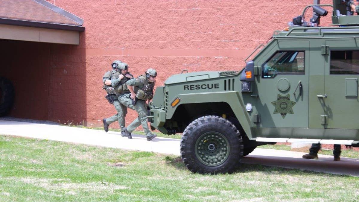 SWAT officers from the Rutherford County Sheriff's Office, seen here in a 2020 training session, stormed a house and arrested Conn on Monday. 