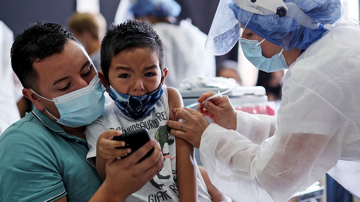 COVID vaccine shot child mask