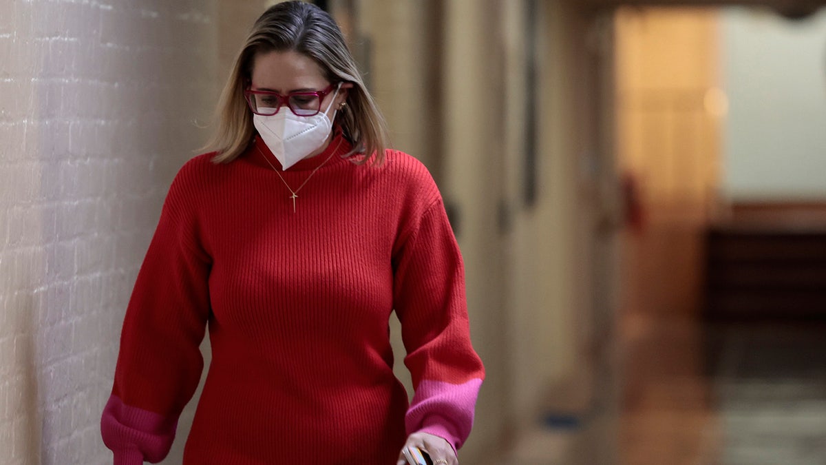 Sen. Kyrsten Sinema walks to her office in the basement of the U.S. Capitol Building on January 19, 2022 in Washington. (Photo by Anna Moneymaker/Getty Images)
