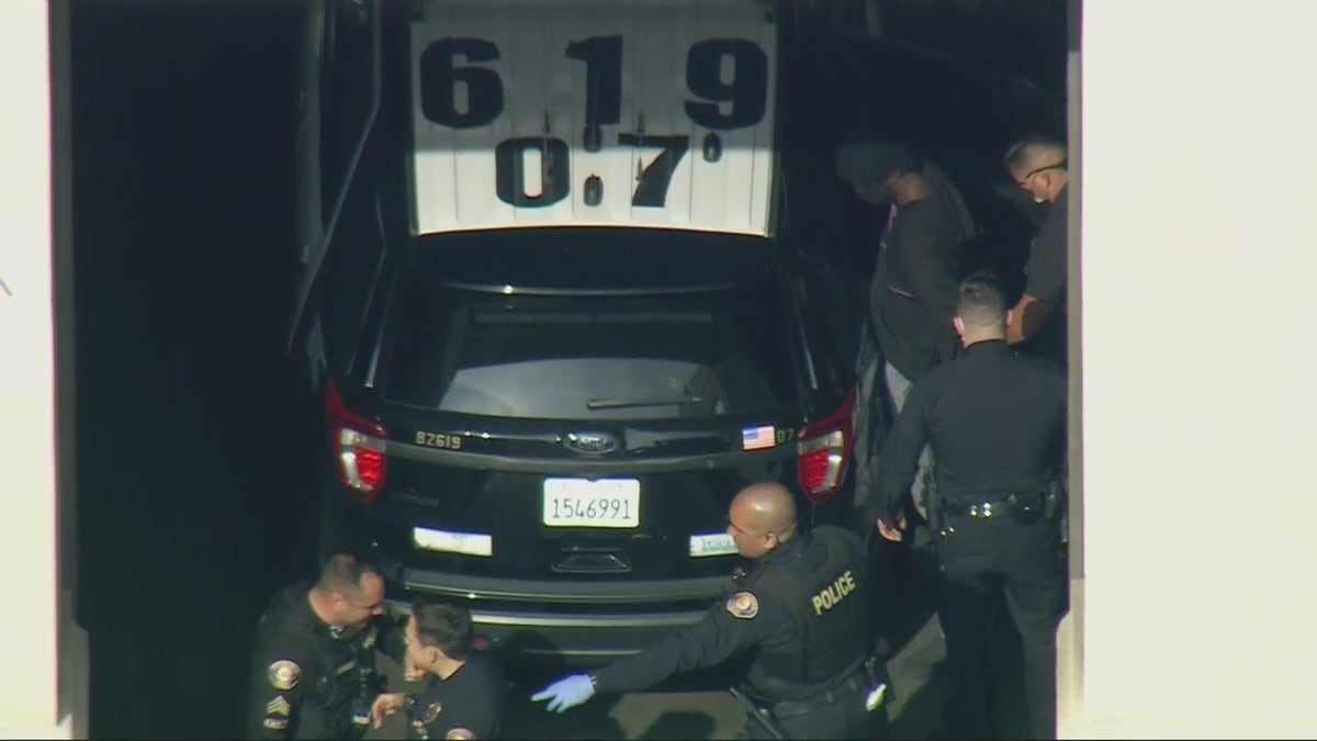 Aerial images obtained by FOX 11 Los Angeles show police putting him into the back of a police SUV ahead of his expected transfer to LAPD custody.