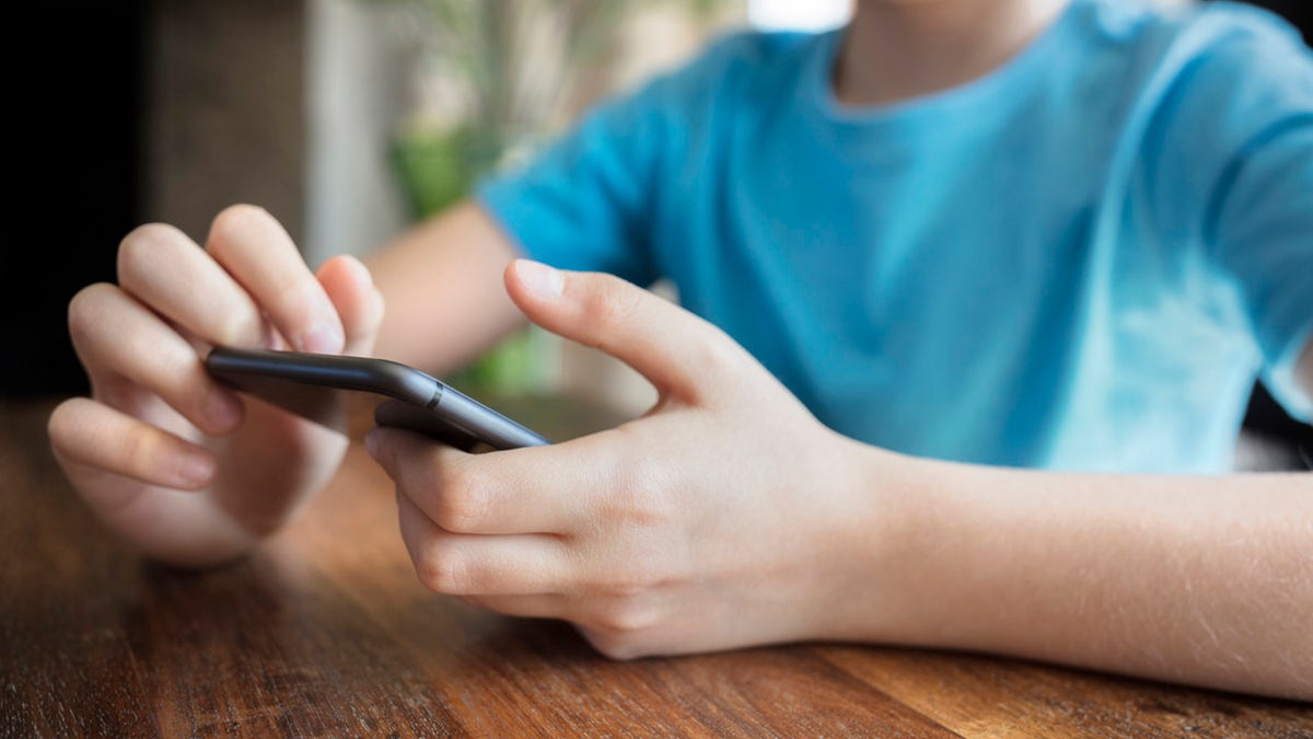 a young person using a cellphone