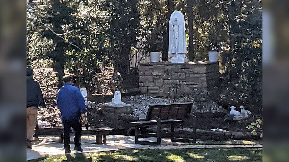 Staff removing the desecrated statues.