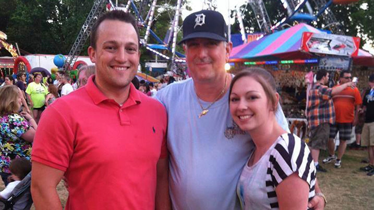 From left, David Bennett Jr., David Bennett Sr. and Nicole (Bennett) McCray at a carnival in 2014.