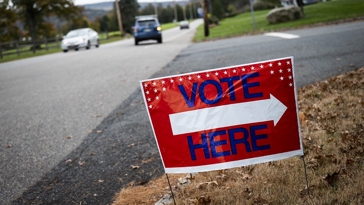 A "Vote Here" sign along the road in Hunterdon County, New Jersey, U.S., on Tuesday, Nov. 2, 2021. 
