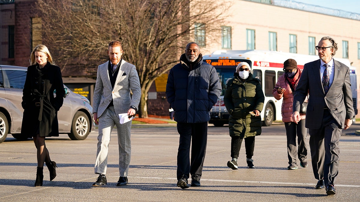Willie Stokes, center, walks from a state prison in Chester, Pennsylvania, on Tuesday, Jan. 4, 2022, after his 1984 murder conviction was overturned because of perjured witness testimony.