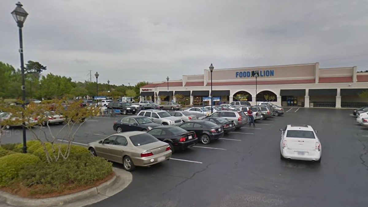 A gunman opened fire at in the parking lot of the Landfall Center shopping complex in Wilmington, N.C., on Saturday, killing two adults, a child and wounding himself, authorities said.