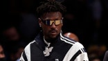Former Tampa Bay Buccaneers wide receiver Antonio Brown arrives courtside during the second half of an NBA basketball game between the Memphis Grizzlies and the Brooklyn Nets, Monday, Jan. 3, 2022, in New York.