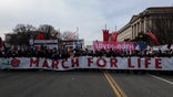 WASHINGTON, DC - JANUARY 21: Anti-abortion activists march during the 49th annual March for Life rally on the National Mall on January 21, 2022 in Washington, DC. The rally draws activists from around the country who are calling on the U.S. Supreme Court to overturn the Roe v. Wade decision that legalized abortion nationwide. (Photo by Anna Moneymaker/Getty Images)