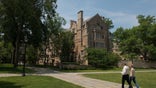 A person walks on Yale's campus