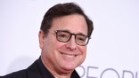 FILE - Bob Saget arrives at the People's Choice Awards at the Microsoft Theater on Wednesday, Jan. 18, 2017, in Los Angeles. Saget, a comedian and actor known for his role as a widower raising a trio of daughters in the sitcom “Full House,” has died, according to authorities in Florida, Sunday, Jan. 9, 2022. He was 65. (Photo by Jordan Strauss/Invision/AP, File)