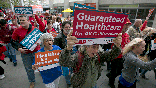 Supporters of single-payer health care march to the Capitol, April 26, 2017, in Sacramento, Calif.