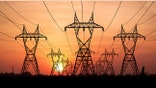 A group of powerlines during sunset