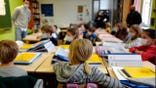 Students attend class on the first day of school for the 2021-2022 year at Gounod Lavoisier Primary school in Lille, northern France, Thursday, Sept. 2 2021. Less than two weeks after the winter term started, French teachers are already exhausted by the pressures of surging COVID-19 cases and they are walking out in nationwide strike organized by their unions to protest virus-linked class disruptions and ever-changing isolation rules. (AP Photo/Michel Spingler, File)