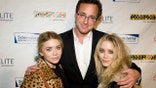 NEW YORK - NOVEMBER 09: Actress Mary Kate Olsen, comedian Bob Saget and Ashley Olsen attend Cool Comedy Hot Cuisine 2009 Benefiting The Scleroderma Research Foundation at Carolines On Broadway on November 9, 2009 in New York City. (Photo by Shawn Ehlers/WireImage for Scleroderma Research Foundation)