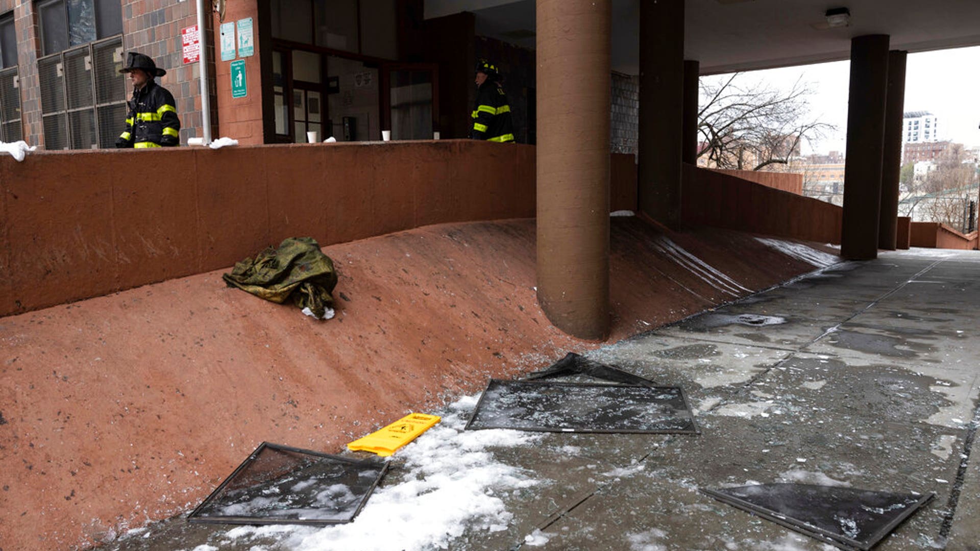 Debris lies on the ground after a fatal fire at an apartment building in the Bronx