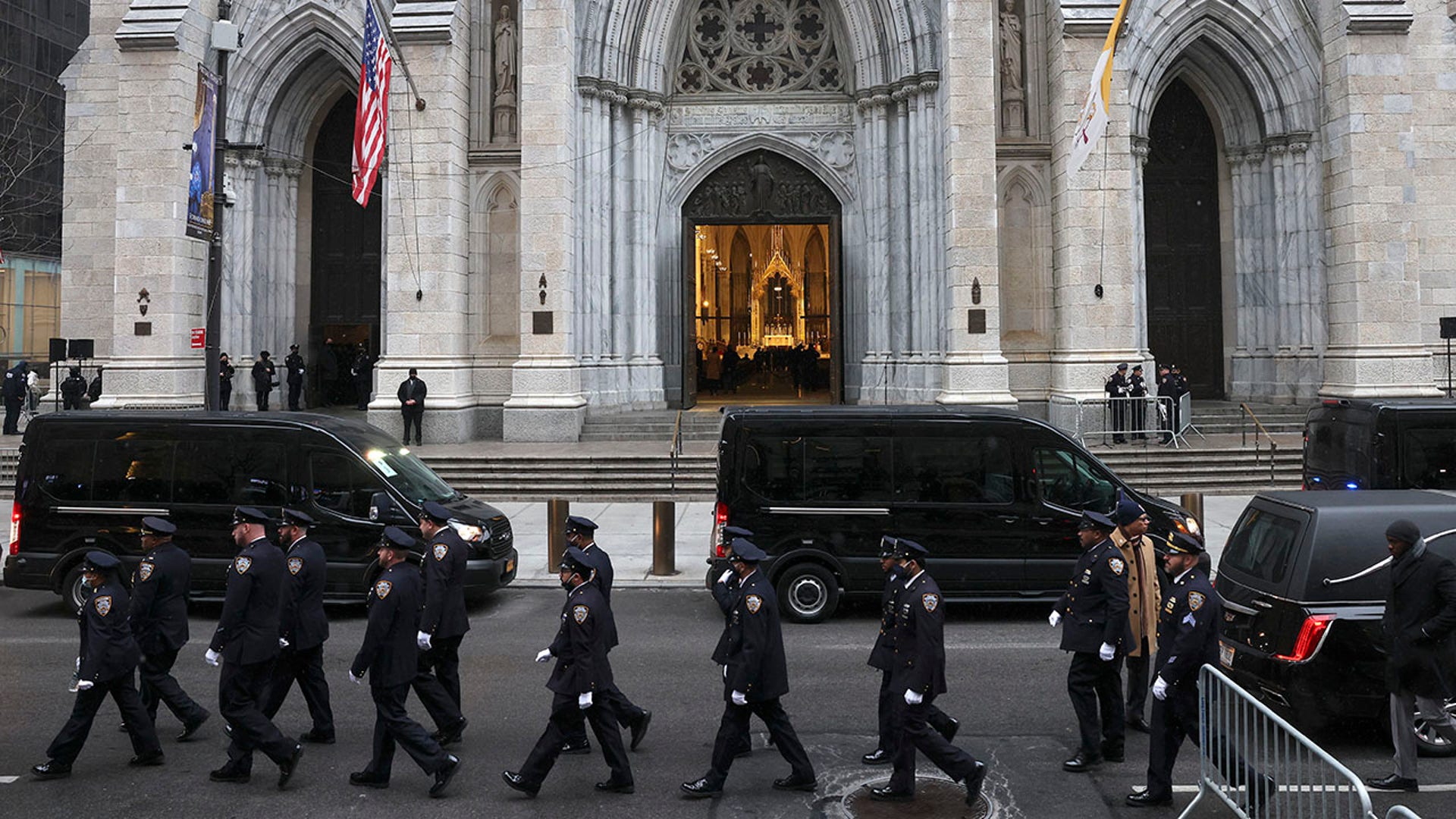 New York police officers gather for the funeral of Officer Jason Rivera, Friday, Jan. 28, 2022, outside St. Patrick's Cathedral in New York. Rivera and his partner, Officer Wilbert Mora, were fatally wounded when a gunman ambushed them in an apartment as they responded to a family dispute last week. (AP Photo/Yuki Iwamura)