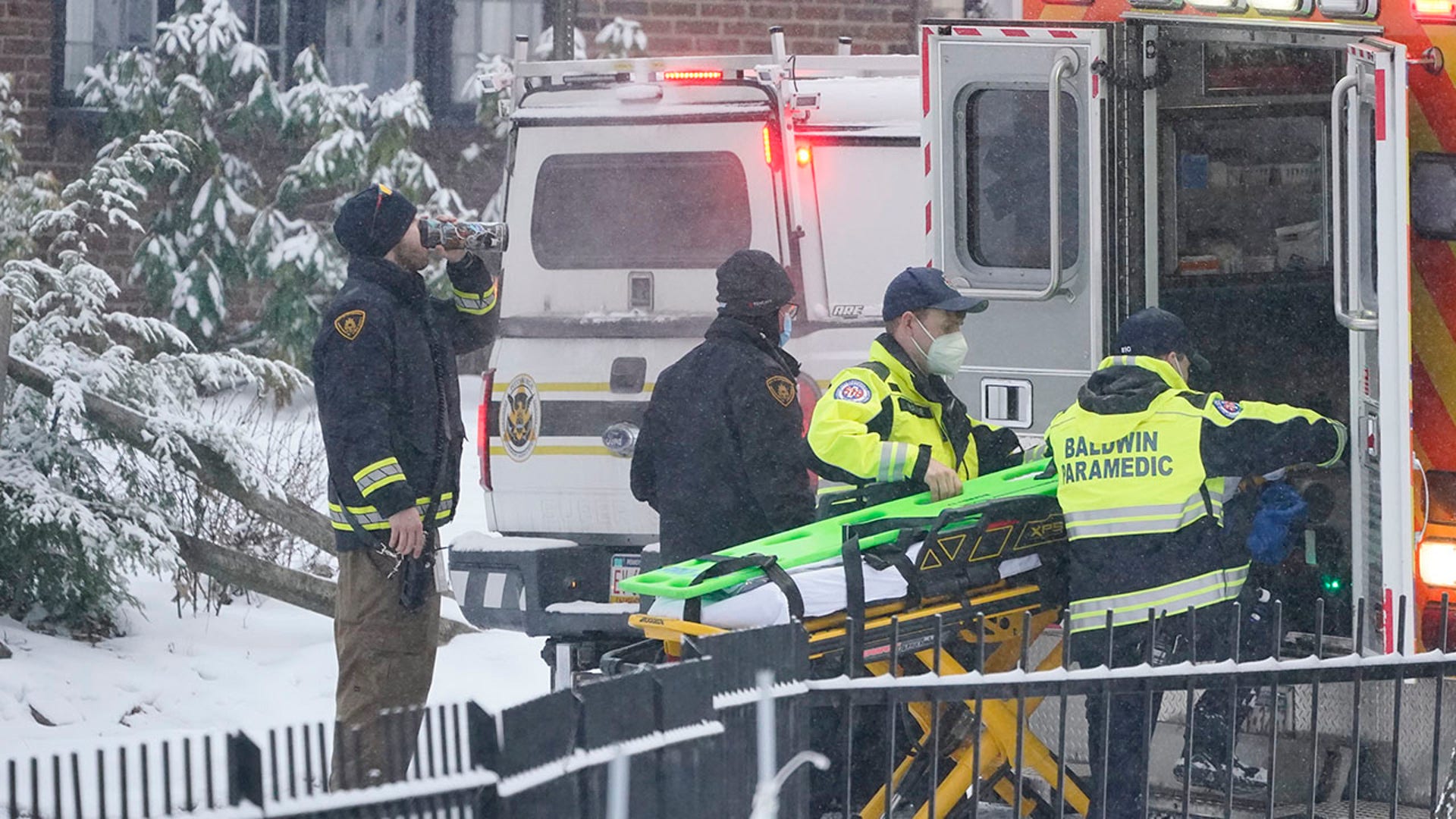 First responders load an empty stretcher into an ambulance at the scene where a bridge collapsed, Friday Jan. 28, 2022, in Pittsburgh's East End. 