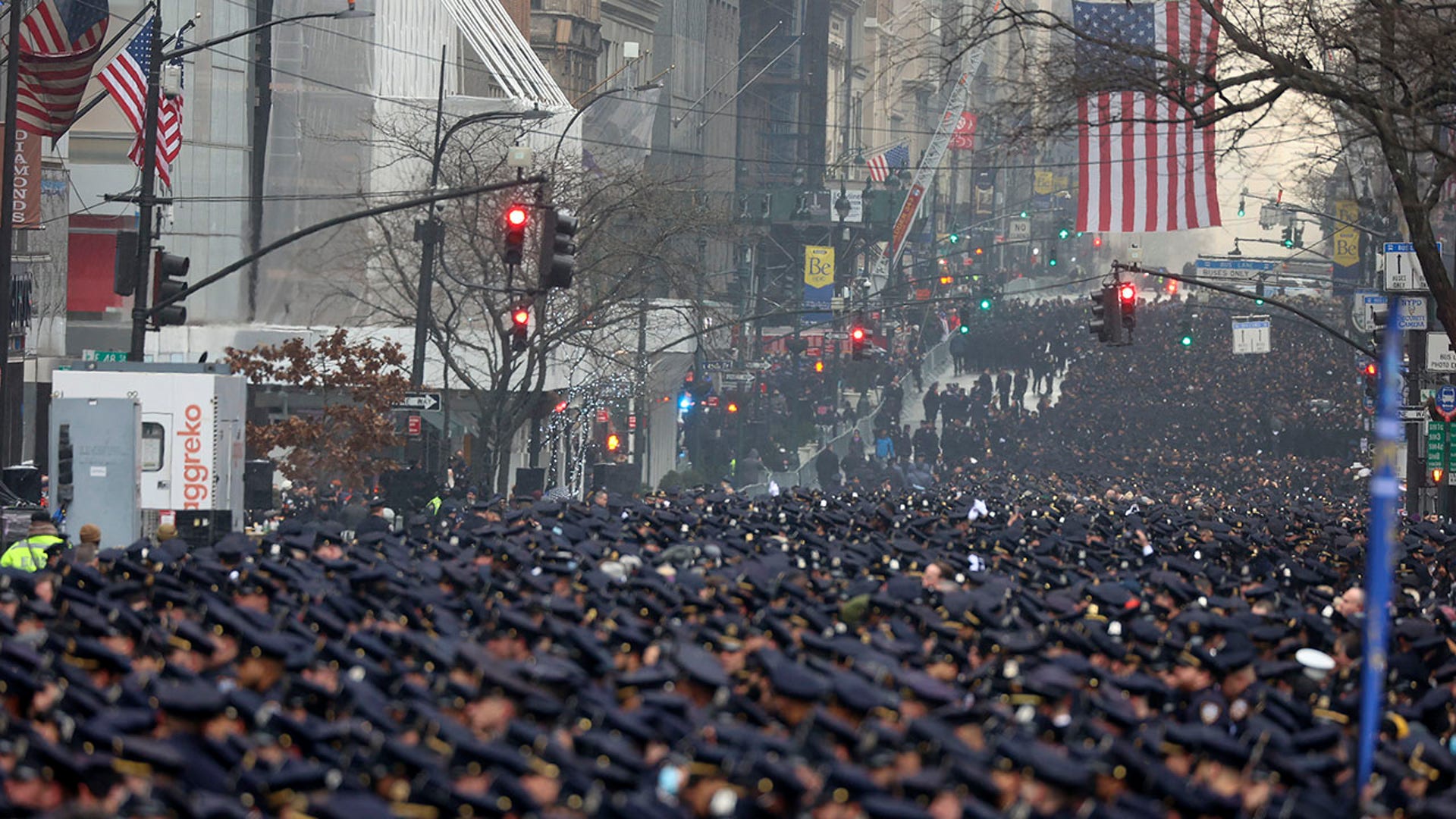 New York Police officers gather along Fifth Avenue for the funeral of officer Jason Rivera, Friday, Jan. 28, 2022, outside St. Patrick's Cathedral in New York. (AP Photo/Yuki Iwamura)