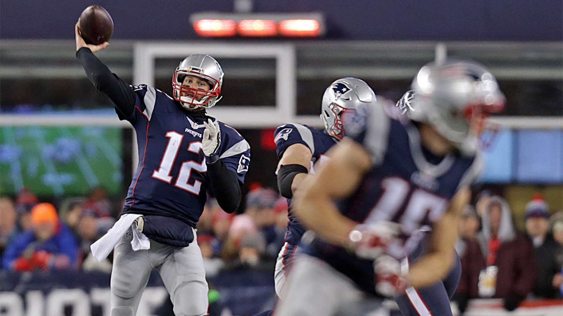 Quarterback #12 Tom Brady throws a pass to wide receiver #15 Chris Hogan in the third quarter of the New England Patriots vs. Houston Texans AFC divisional game at Gillette Stadium.