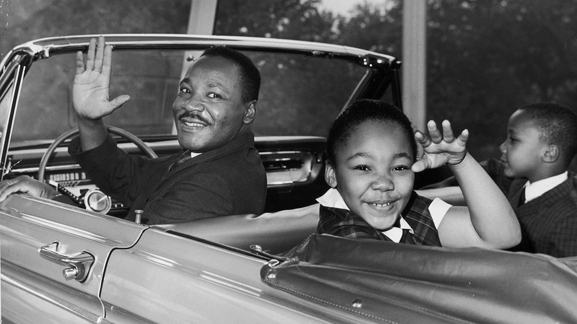  American civil rights leader Martin Luther King Jr. waves with his children Yolanda and Martin Luther III from the Magic Skyway ride at the Worlds Fair, New York City on Aug. 12, 1964. 