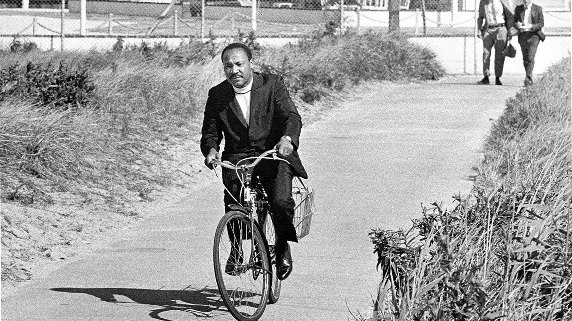 Dr. Martin Luther King Jr. rides a bicycle on Fire Island, New York, on Sept. 2, 1967. (