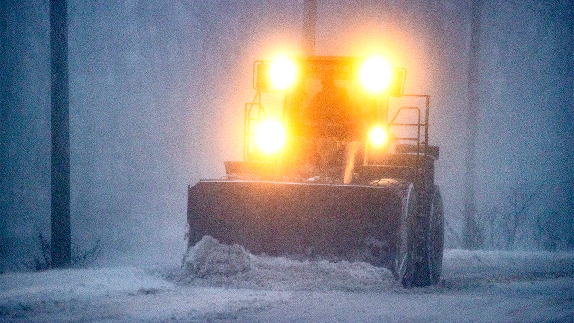 Plow in whiteout, East Squantum St. during the snowstorm in Quincy, MA on Jan. 29, 2022.