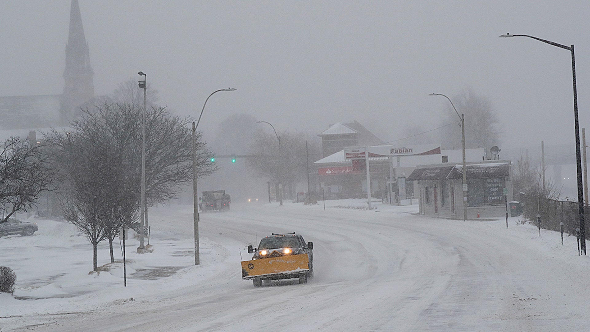 Plow in whiteout, East Squantum St. during the snowstorm in Quincy, MA on Jan. 29, 2022.