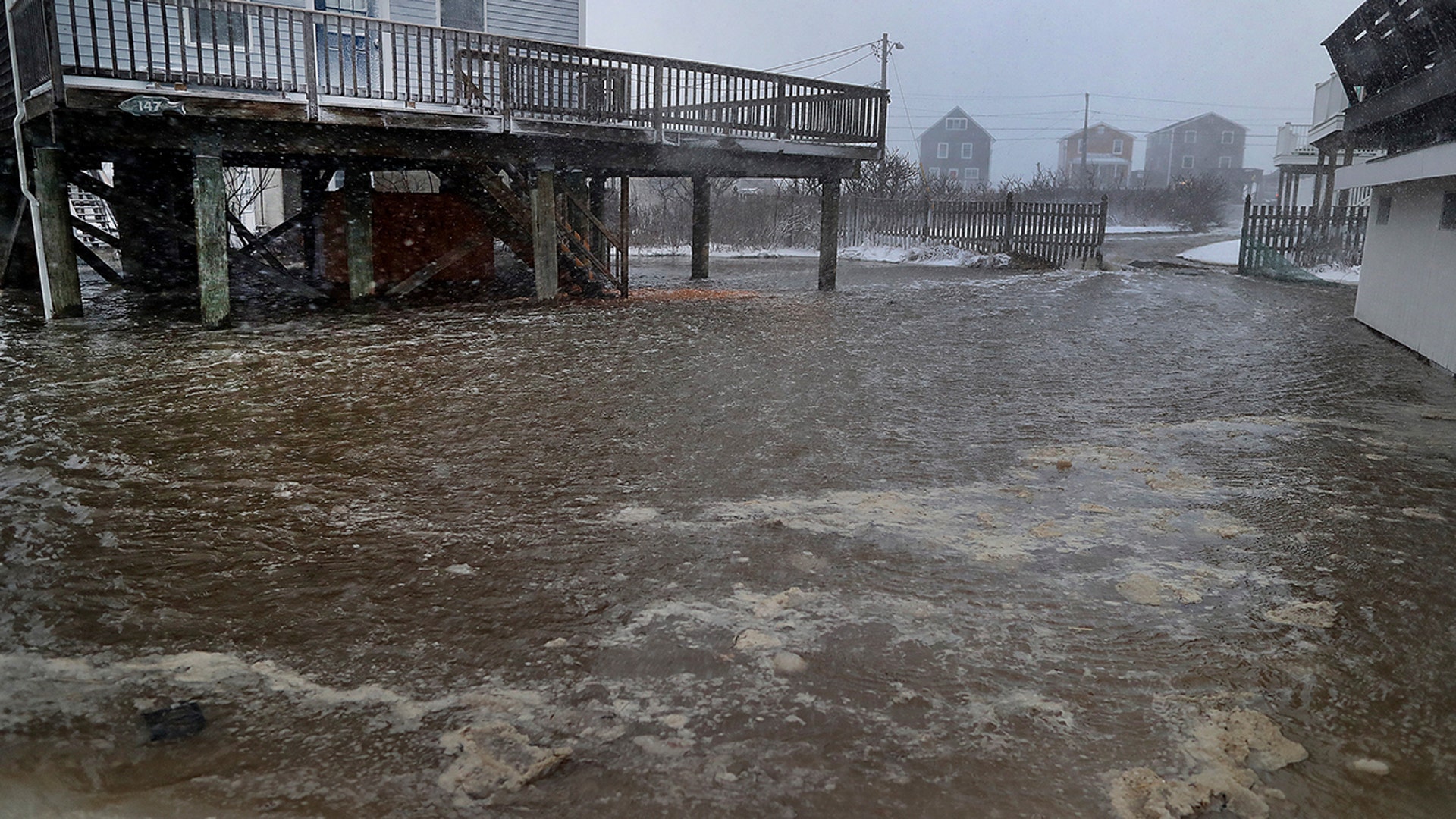 Plow in whiteout, East Squantum St. during the snowstorm in Quincy, MA on Jan. 29, 2022.