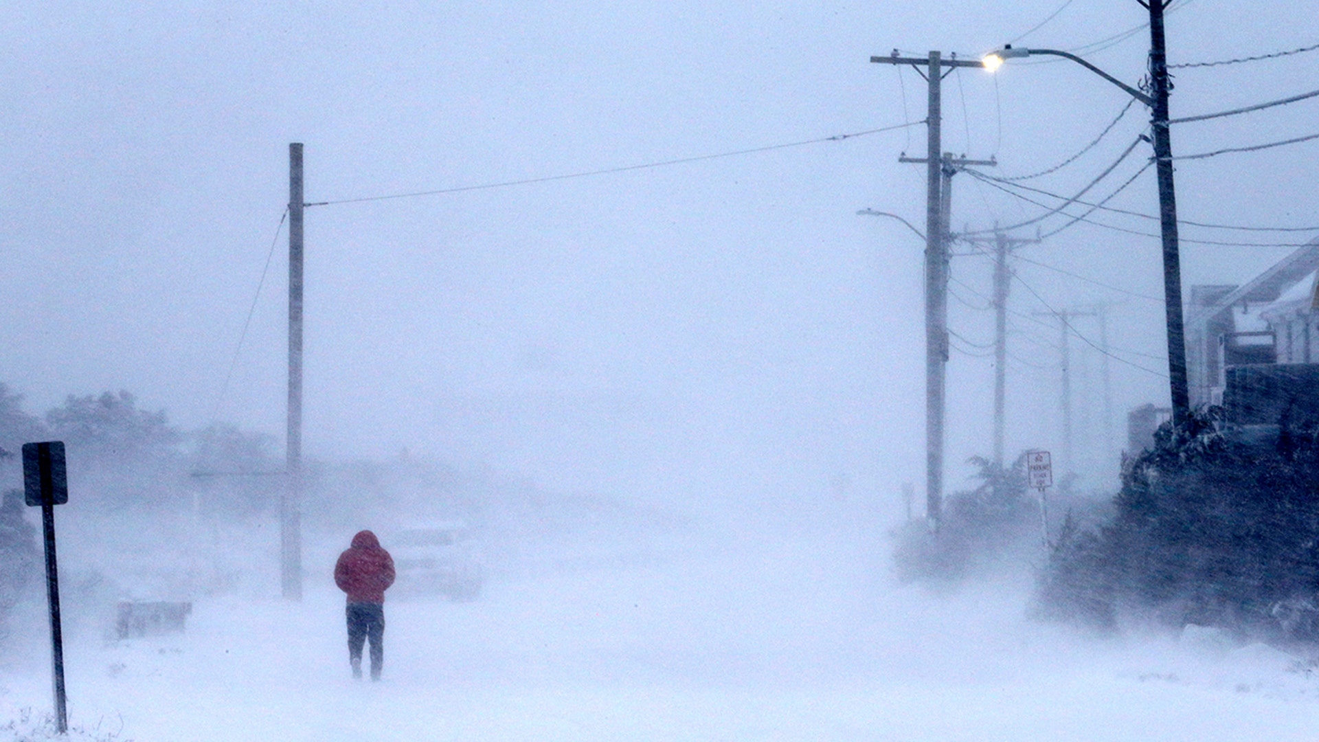 Plow in whiteout, East Squantum St. during the snowstorm in Quincy, MA on Jan. 29, 2022.