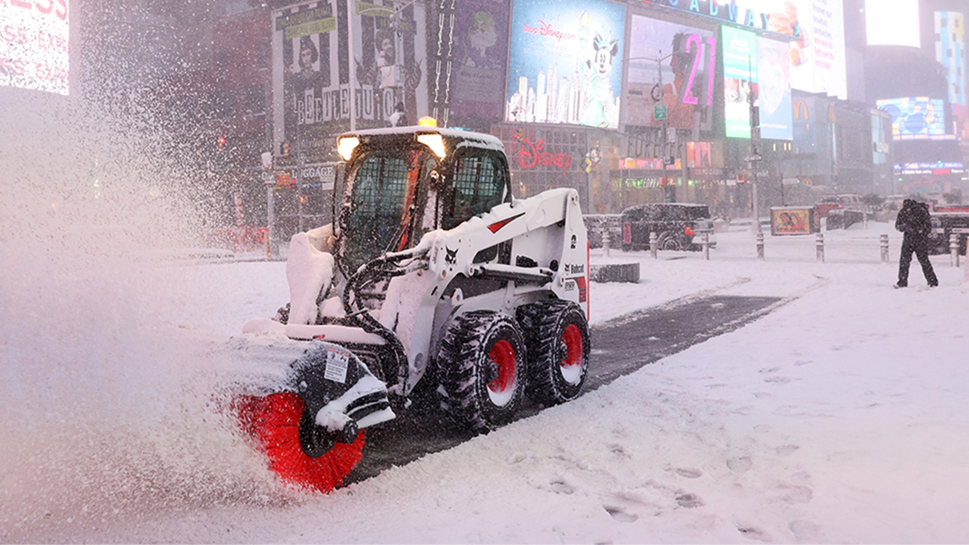 A plow clears snow in Times Square during a Nor'easter storm in Manhattan, New York City, U.S., January 29, 2022.