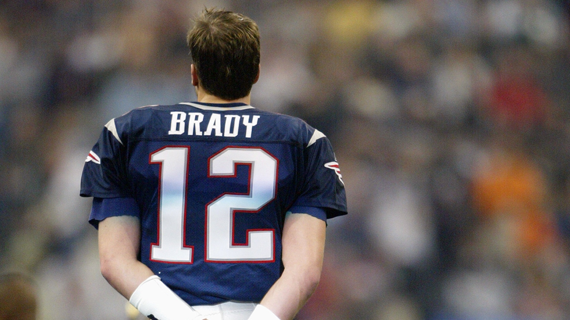 Quarterback Tom Brady #12 of the New England Patriots looks on during a break in game action against the Carolina Panthers during Super Bowl XXXVIII at Reliant Stadium on February 1, 2004 in Houston, Texas.