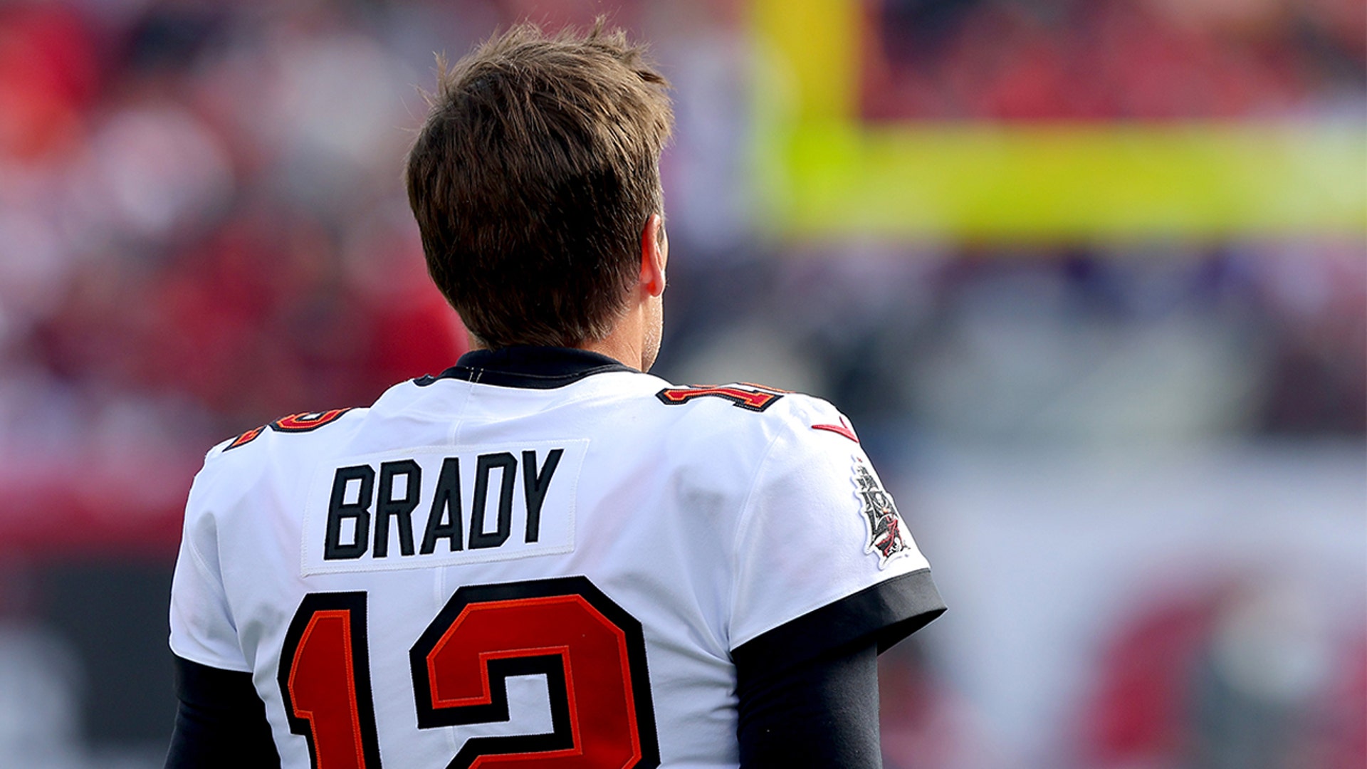Tom Brady #12 of the Tampa Bay Buccaneers looks on before the game against the Los Angeles Rams in the NFC Divisional Playoff game at Raymond James Stadium on January 23, 2022 in Tampa, Florida.
