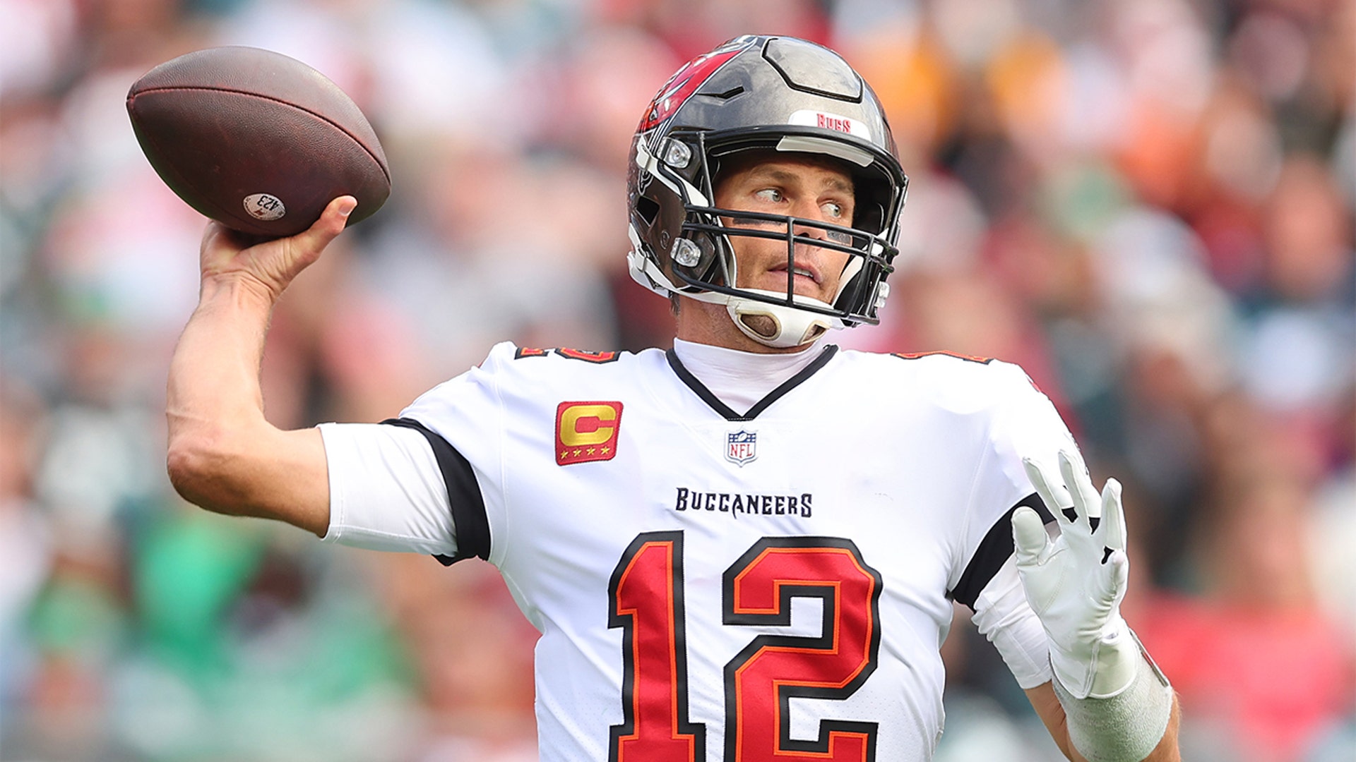 Tom Brady #12 of the Tampa Bay Buccaneers throws a pass against the Philadelphia Eagles in the first half of the NFC Wild Card Playoff game at Raymond James Stadium on January 16, 2022 in Tampa, Florida.